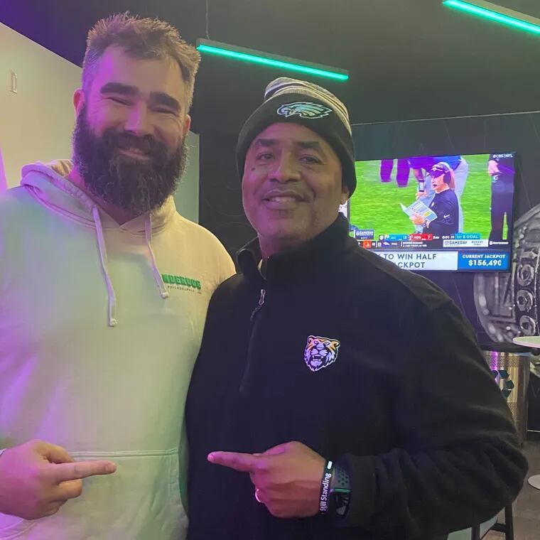 Jason Kelce with Mike Jones, his football coach at Cleveland Heights High, after the Eagles defeated the Buffalo Bills on Nov. 26, 2023 at Lincoln Financial Field.