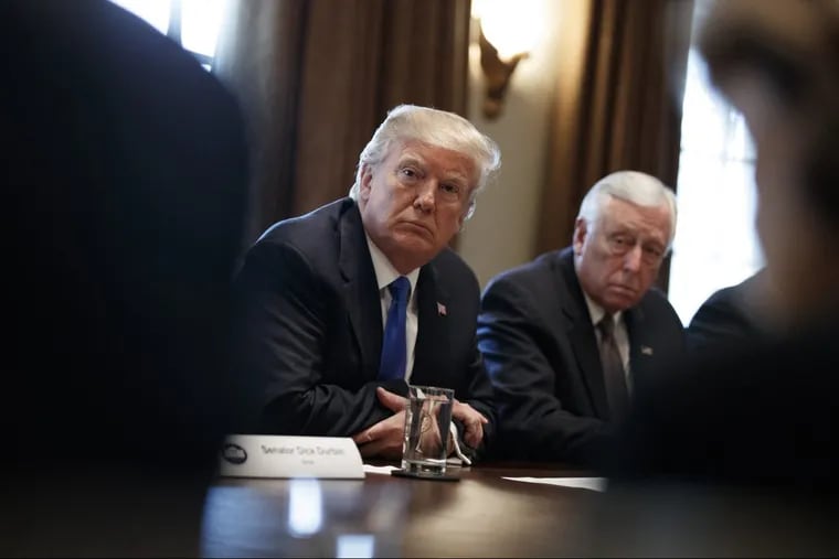 President Trump listens during a meeting with lawmakers on immigration policy in the Cabinet Room of the White House on Tuesday.