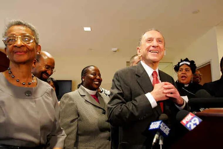 Sen. Arlen Specter (right foreground) gained the backing yesterday of the Black Clergy of Philadelphia and Vicinity, led by Bishop Audrey Bronson (left).