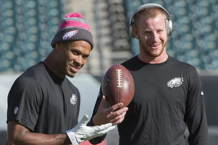 Eagles quarterback Carson Wentz (right) and receiver Jordan Matthews share a laugh before the Vikings game on October 23, 2016.