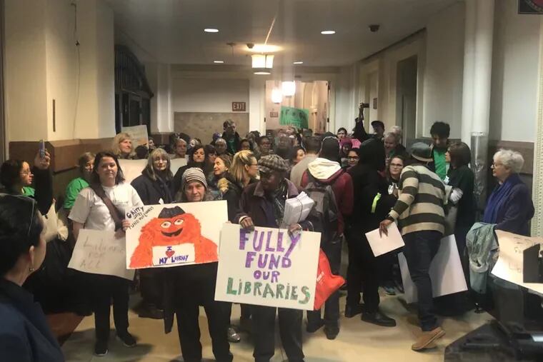Philadelphia advocates rally for more Free Library funding outside of Mayor Jim Kenney's office on Dec. 12, 2018.