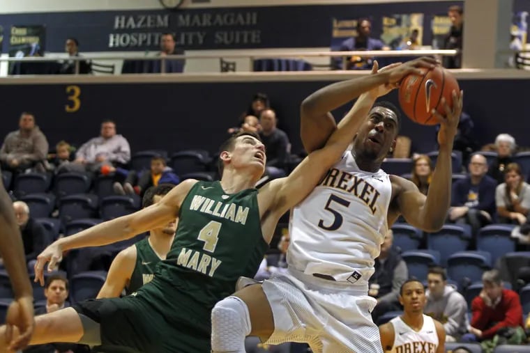 Drexel’s Austin Williams (5) fight for rebound against William and Mary in February. He made the big block Thursday night.