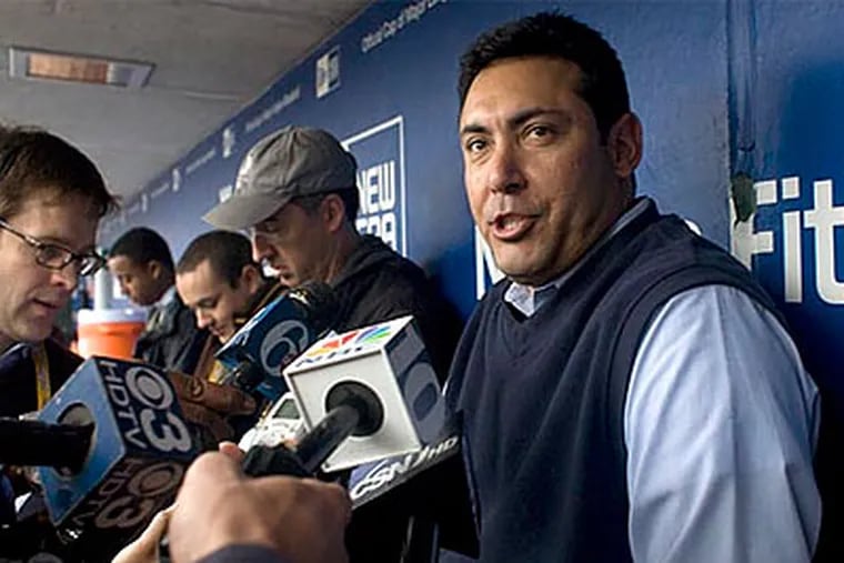 Phillies general manager Ruben Amaro Jr. is in the spotlight as he tries to finish a deal to bring Roy Halladay to Philadelphia. (Ed Hille/Staff file photo)