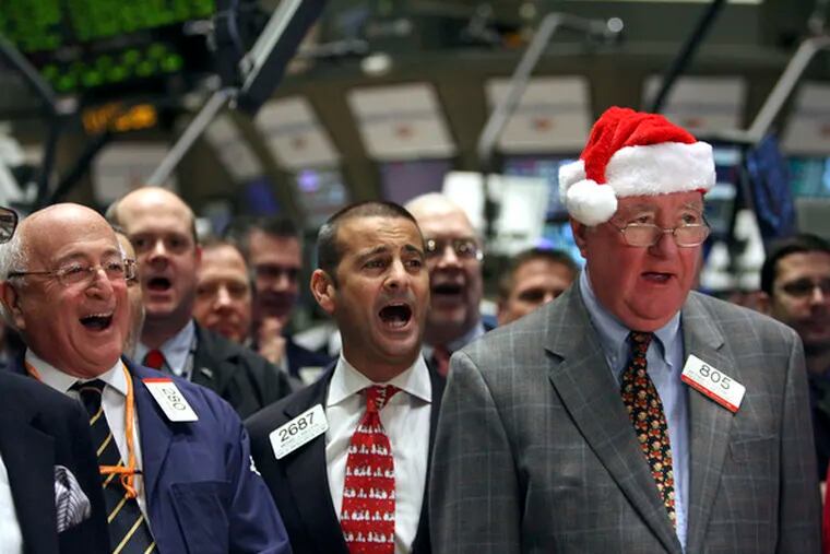 Among the traders singing &quot;Wait Till the Sun Shines, Nellie,&quot;a New York Stock Exchange holiday tradition, are (from left) Theodore Weisberg, Michael Sollitto and Arthur Cashin.