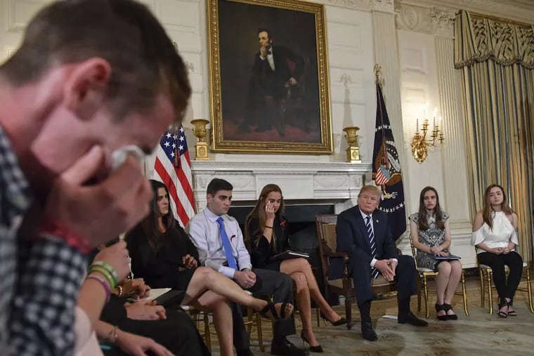 Samuel Zeif, a student at Marjory Stoneman Douglas High School, weeps after recounting his story of the shooting at his high school as other students and teachers listen, including President Trump, during an event at the White House Wednesday.