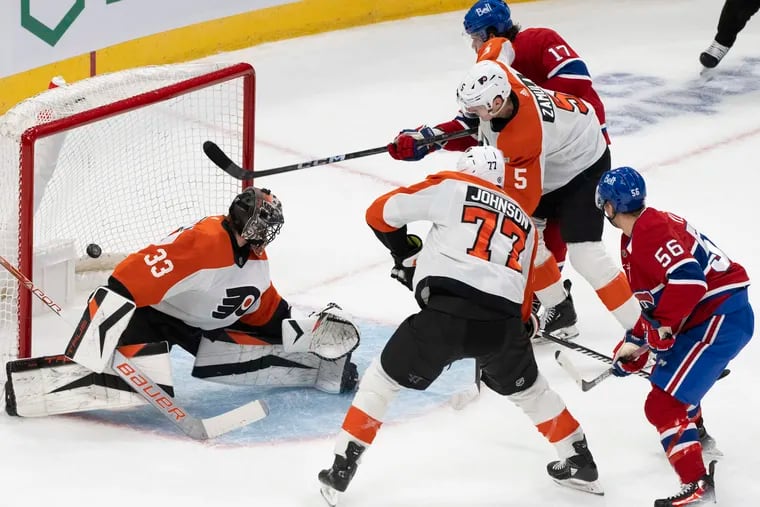 Montreal Canadiens' Jesse Ylonen (56) scores on Philadelphia Flyers goaltender Samuel Ersson (33) during the first period of an NHL hockey game Thursday, March 28, 2024, in Montreal. (Christinne Muschi/The Canadian Press via AP)
