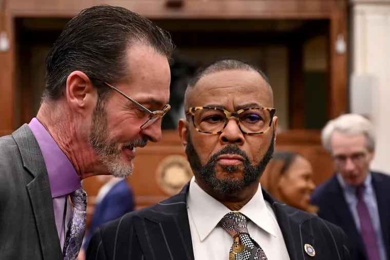 In this December file photo, Councilmember Jim Harrity (left) and Councilmember Curtis Jones Jr. (right) talk before the start of a City Council meeting. Both are members of Councils Committee on Public Safety, which on Tuesday considered legislation banning some businesses from having skill games.