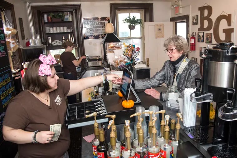 Kristin Haynie, 22, Burlington City, a special needs adult, hands change to customer Valarie Casale, Manchester, NJ, in Breaking Ground Coffee and Cafe October 17, 2019. The coffeehouse is part of the growing trend in businesses which hire adults with intellectual and/or developmental challenges.