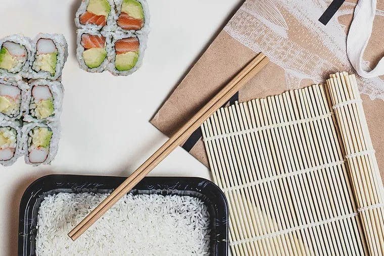 Sushi kit from Tuna Bar includes rice, vinegar, fish, and a bamboo mat.