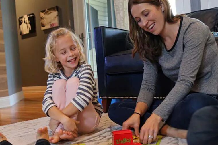 Adali Antisdel, 6, plays a board game with her mother, Jamie Antisdel, and the rest of her family. Adali was born three months premature. (J.B. Forbes/St. Louis Post-Dispatch/MCT)