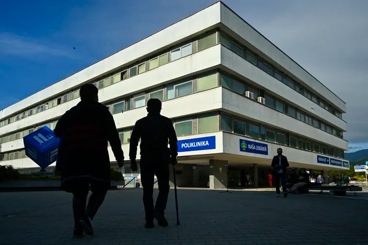 People walk outside the F. D. Roosevelt University Hospital, where Slovak Prime Minister Robert Fico, who was shot and injured, is treated in Banska Bystrica, central Slovakia, on Thursday.