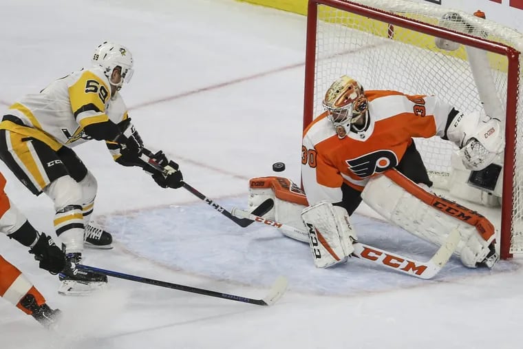 Flyers' goalie Michal Neuvirth can't stop the goal by Penguins' Jake Guentzel during the third period of game six in round one of the NHL Playoffs at the Wells Fargo Center Sunday. The Penguins beat the Flyers 8-5 and win the series.