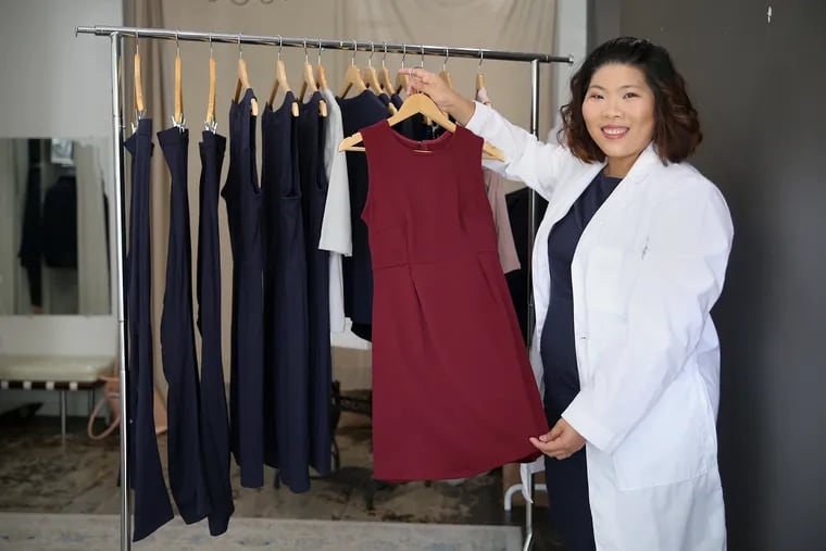 Beau Wangtrakuldee with a stain-resistant dress from her AmorSui clothing line at the 323 Arch Fashion Collective space in Old City.