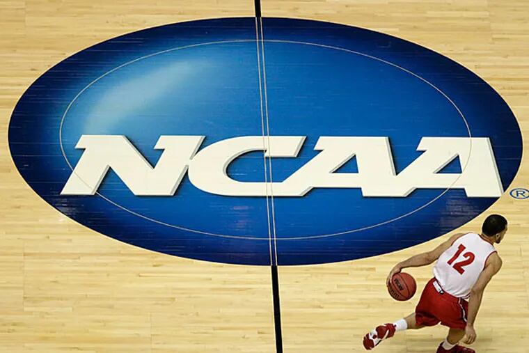 Wisconsin's Traevon Jackson dribbles past the NCAA logo during practice at the NCAA men's college basketball tournament Wednesday, March 26, 2014, in Anaheim, Calif. Wisconsin plays Baylor in a regional semifinal on Thursday. (Jae C. Hong/AP)