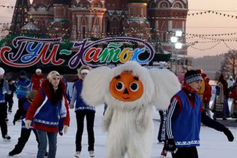 People skate in Moscow&#0039;s Red Square in front of St. Basil Cathedral. The city has set up the rink the last few years.
