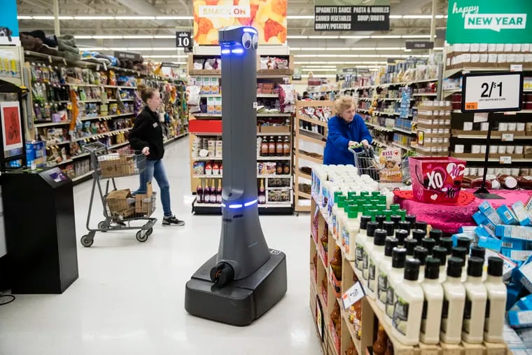 A robot named Marty cleans the floors at a Giant grocery story in Harrisburg, Pa., Tuesday, Jan. 15, 2019. On Monday, the Carlisle-based Giant Food Stores announced new robotic assistants will be arriving at all 172 Giant stores by the middle of this year. The chain's parent company says it plans to eventually deploy the robots to nearly 500 stores. (AP Photo/Matt Rourke)