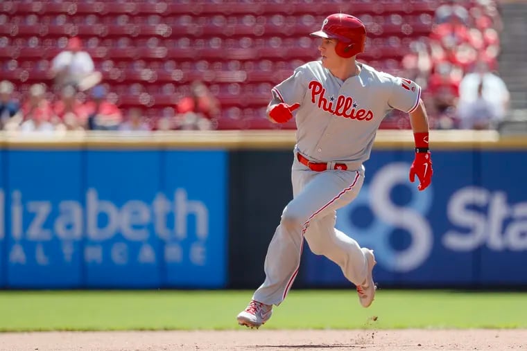 Phillies catcher J.T. Realmuto  runs to third on a triple hit off Cincinnati Reds starting pitcher Sonny Gray in the fourth inningi.