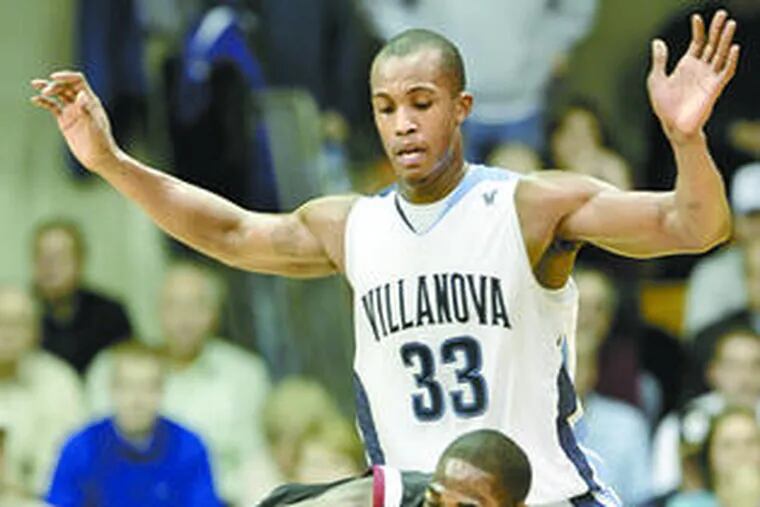St. Joseph&#0039;s Ahmad Nivins falls while being harassed by Villanova&#0039;s Dante Cunningham during Big Five action at the Palestra. Nivins contributed 16 points and eight rebounds. Cunningham scored 14.