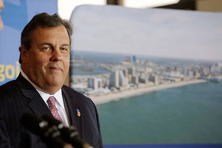 New Jersey Gov. Chris Christie smiles as he stands near a photograph of Atlantic City in Newark Liberty International Airport in Newark, N.J., Thursday, Nov. 14, 2013, during an announcement that United Airlines will begin service to Atlantic City International Airport starting in April.  (AP Photo/Mel Evans)