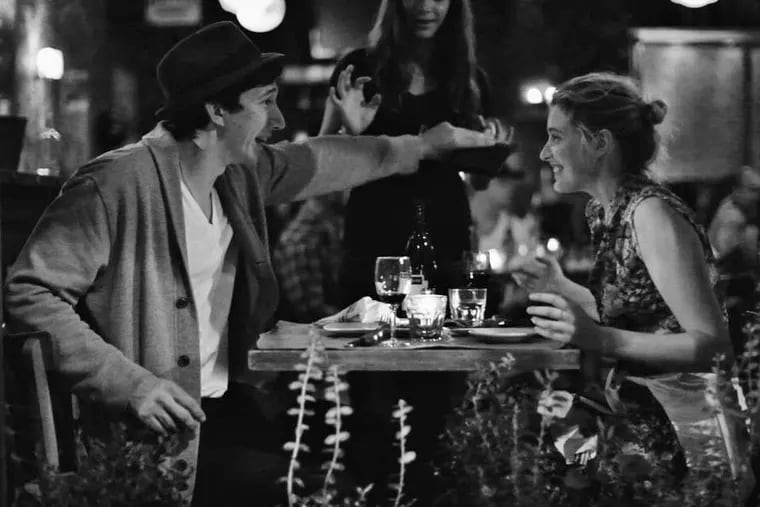Frances (Greta Gerwig) dines with Lev (Adam Driver), with whom she shares an apartment while waiting for her career to take off.