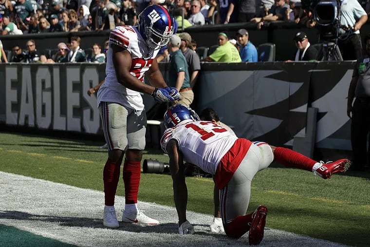 New York Giants’ Odell Beckham, right, celebrates with Sterling Shepard after a touchdown during the second half of an NFL football game against the Philadelphia Eagles, Sunday, Sept. 24, 2017, in Philadelphia.