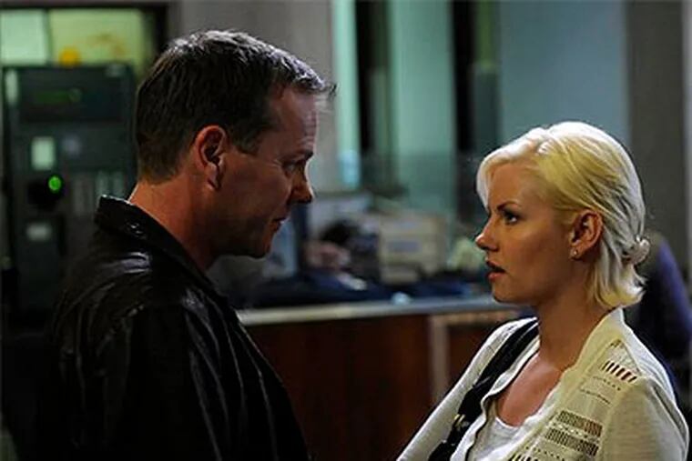 Keifer Sutherland, left, and Elisha Cuthbert are shown in a scene from the action series, "24." Another dark day dawns with the season eight premiere on Sunday at 8 p.m. (AP Photo / Fox, Kelsey McNeal)
