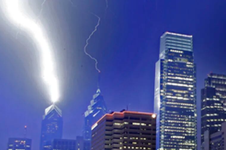 THE SPIRIT of Ben Franklin, still protecting the city: Franklin began making the first lightning rods in the 1750s to prevent electrical-storm damage. Here, lightning strikes the rods on Liberty One and Two during last night&#0039;s storm.