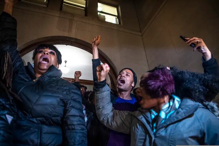 People, including Khalil Darden, 18, of Penn Hills, Pa., center, and Pennsylvania State Rep. Summer Lee, right, protest after they learned a not guilty verdict in the homicide trial of former East Pittsburgh police Officer Michael Rosfeld, Friday, March 22, 2019, at the Allegheny County Courthouse in downtown Pittsburgh, Pa. A jury acquitted Rosfeld, a former police officer Friday in the fatal shooting of Antwon Rose II, an unarmed teenager as he was fleeing a high-stakes traffic stop outside Pittsburgh, a confrontation that was captured on video and led to weeks of unrest.