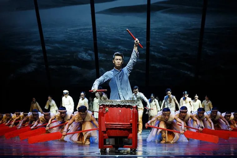 A dancer drums during a performance of &quot;Dragon Boat Racing.&quot; The award-winning performance will come to the Kimmel Center this week.