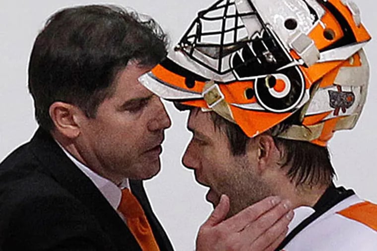 Flyers head coach Peter Laviolette congratulates Brian Boucher after the Game 7 win. ( Ron Cortes / Staff Photographer )