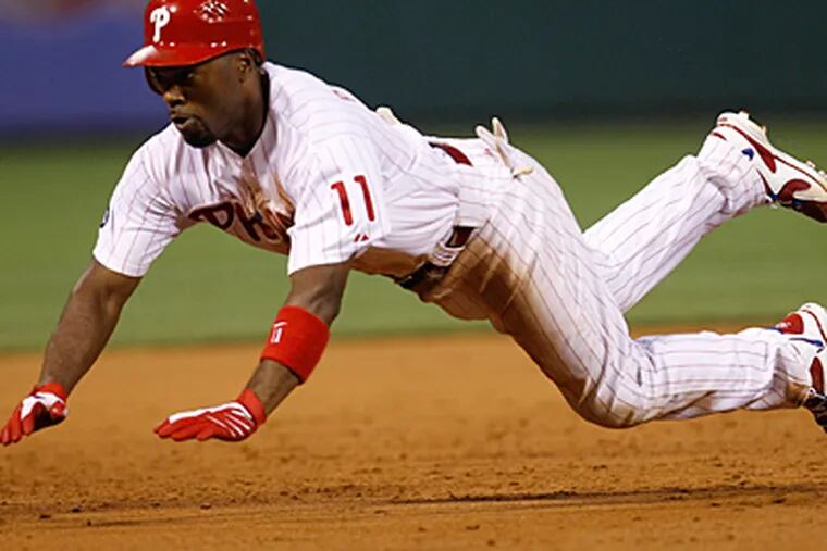 Jimmy Rollins will be one player to watch in spring training after playing in only 88 games last season while battling injury. (Matt Rourke/AP)