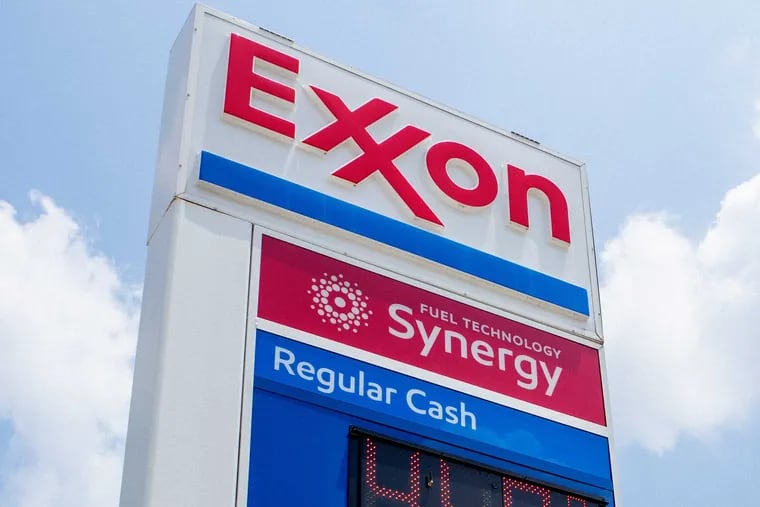 File: Exxon Mobil gas station sign in Houston, Texas.