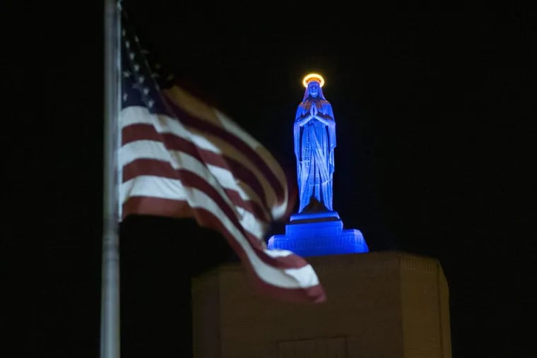 Cooper University Health Care has decided not to pursue the acquisition of Lourdes Health System and St. Francis Medical Center. Show here is the the Virgin Mary statue atop Our Lady of Lourdes Medical Center in Camden lighted blue November 3, 2016, in honor of the Chicago Cubs’  World Series victory.