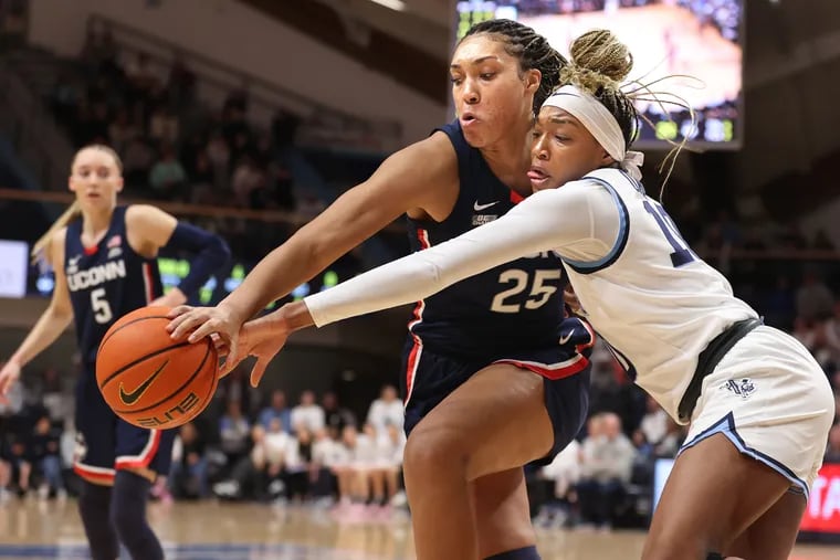Christina Dalce, right, of Villanova and Ice Brady, center, of UConn go after the ball during the first half on Jan. 31, 2024 at the Finneran Pavilion at Villanova University.
