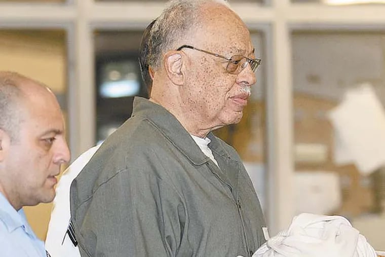 Dr. Kermit Gosnell gets escorted to a van leaving the Criminal Justice Center after getting convicted on three counts of first degree murder on Monday, May 13, 2013.  ( Yong Kim / Staff Photographer )