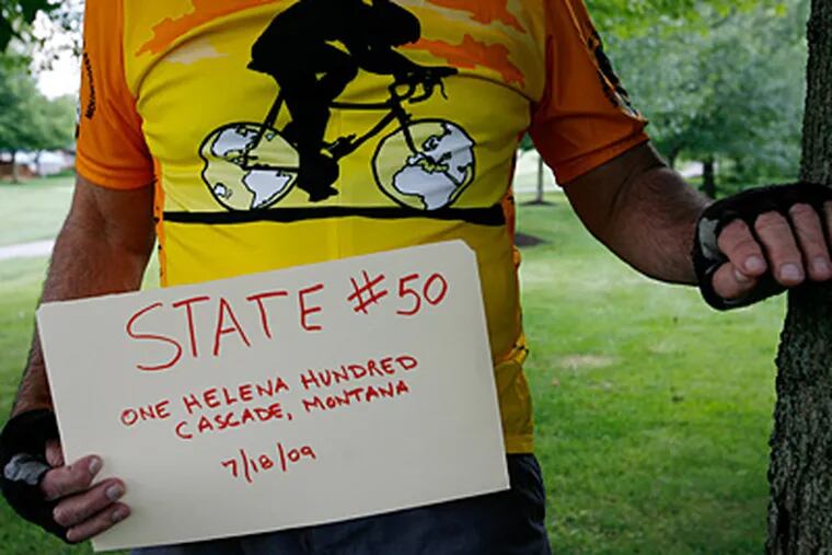 Al Emma's homemade sign will announce the completion of a 100-mile ride in Montana, the cyclist's 50th &quot;century&quot; state. (Michael Wirtz / Staff Photographer)