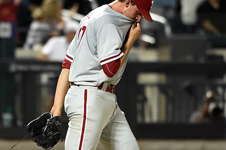 Philadelphia Phillies starting pitcher Aaron Nola (27) reacts on the
mound after giving up a two-run home run to New York Mets'  Michael
Conforto in the third inning of a baseball game on Wednesday, Sept. 2,
2015, in New York.