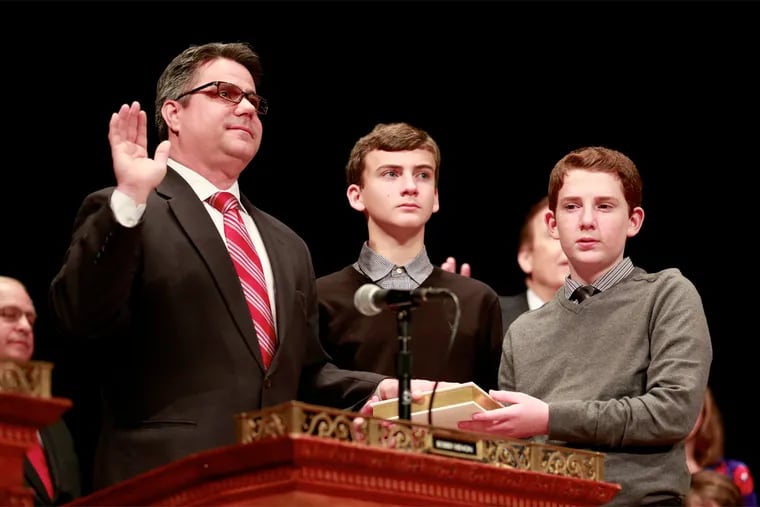 Councilman Bobby Henon is sworn in with his sons Matthew and Zachary ( R ) during Kenney's inauguration as 99th Mayor of Philadelphia at the Academy of Music Monday January 4, 2016.
