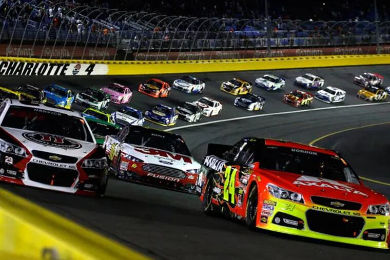 Jeff Gordon (24) leads the field of drivers out of Turn 4 approaching the start of the NASCAR Sprint Cup Series auto race at Charlotte Motor Speedway in Concord, N.C., Saturday, Oct. 12, 2013. (Gerry Broome/AP)