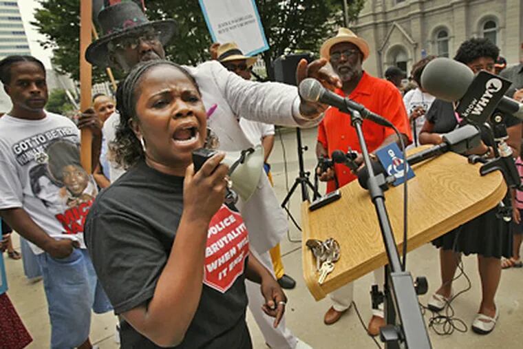 Yolanda Dyches, whose nephew was one of three men seen in a video last year being beaten by police, complains at the demonstration about a grand-jury report that cleared the officers. (Alejandro A. Alvarez / Staff Photographer)
