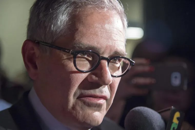 Larry Krasner talks to the media at his primary election night party in May.