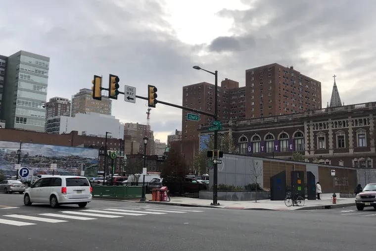 Proposed development site for Brandywine's 23-story commercial and residential tower seen here to the left, behind memorial to victims of deadly 2013 building collapse.