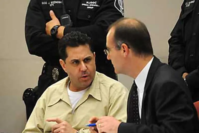 Craig Arno, left, speaks with his attorney Eric Shenkus after his sentencing for the murder of Martin Caballero in Superior Court, Mays Landing, N.J. Thursday, May, 24, 2012. Arno was sentenced to 120 years in prison, and must serve 102 years before becoming eligible for parole. (AP Photo/Press of Atlantic City, Danny Drake)