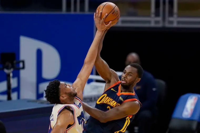 Sixers center Tony Bradley stuffing a pass by Golden State forward Andrew Wiggins during the first half Tuesday.