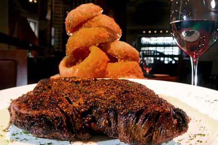 Porterhouse is a good selection, and onion rings have recovered from early doughiness and become crisp and addictive. (David M Warren/Staff Photographer)