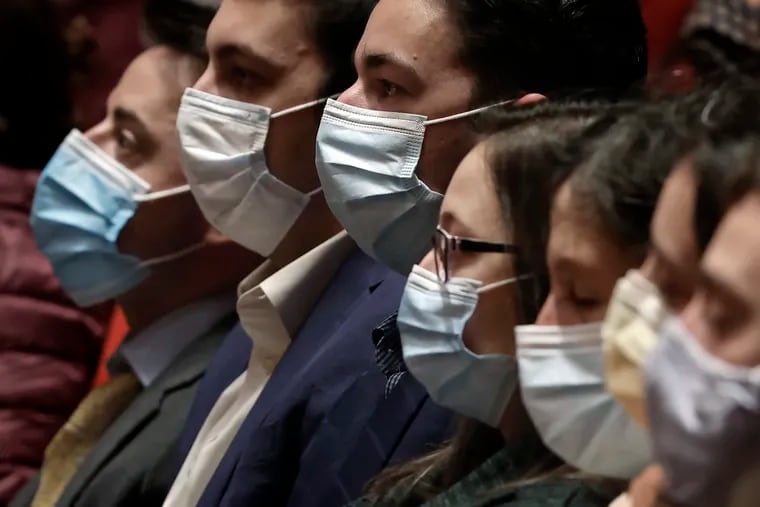 Guests watch and listen to the Philadelphia Orchestra perform the Messiah at the Kimmel Center’s Verizon Hall on Wednesday. Because of COVID-19, all guests at the Kimmel Center must show proof of COVID-19 vaccination and must wear a mask.