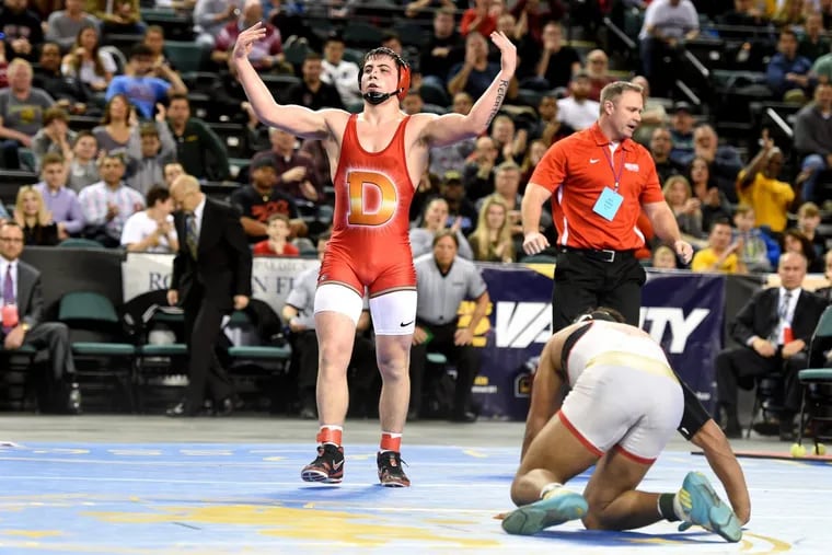 Delsea’s Billy Janzer celebrates after he beat Bergen Catholic’s Josh McKenzie (right) in a tiebreaker to win the 182-pound final at the 2018 NJSIAA State Wrestling Championships Sunday.
