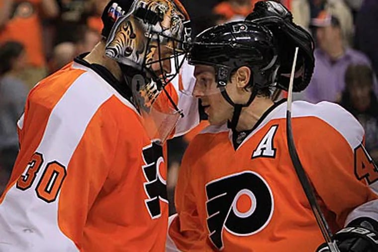 Ilya Bryzgalov celebrates with Danny Briere after the Flyers shut out the Devils on Tuesday. (Ron Cortes/Staff Photographer)