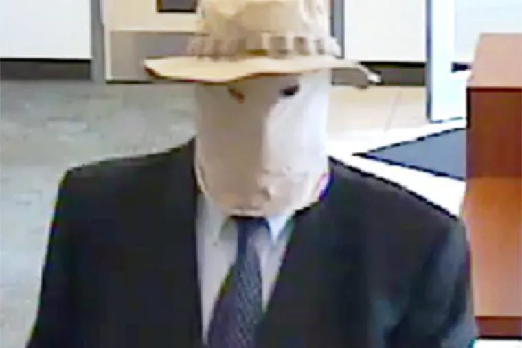 Richard Boyle, who earned the moniker "The Straw Hat Bandit" after a string of 19 bank robberies, appears in surveillance video image during one of his hits.