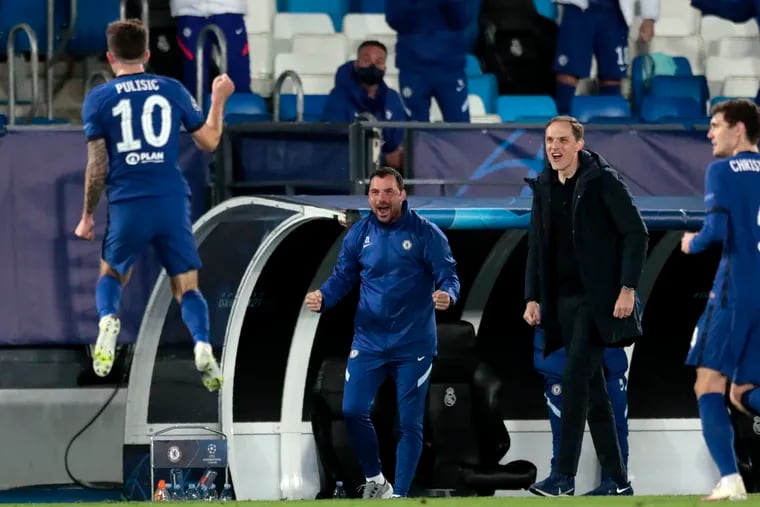 Christian Pulisic, left, celebrates near Chelsea's bench after scoring against Real Madrid.